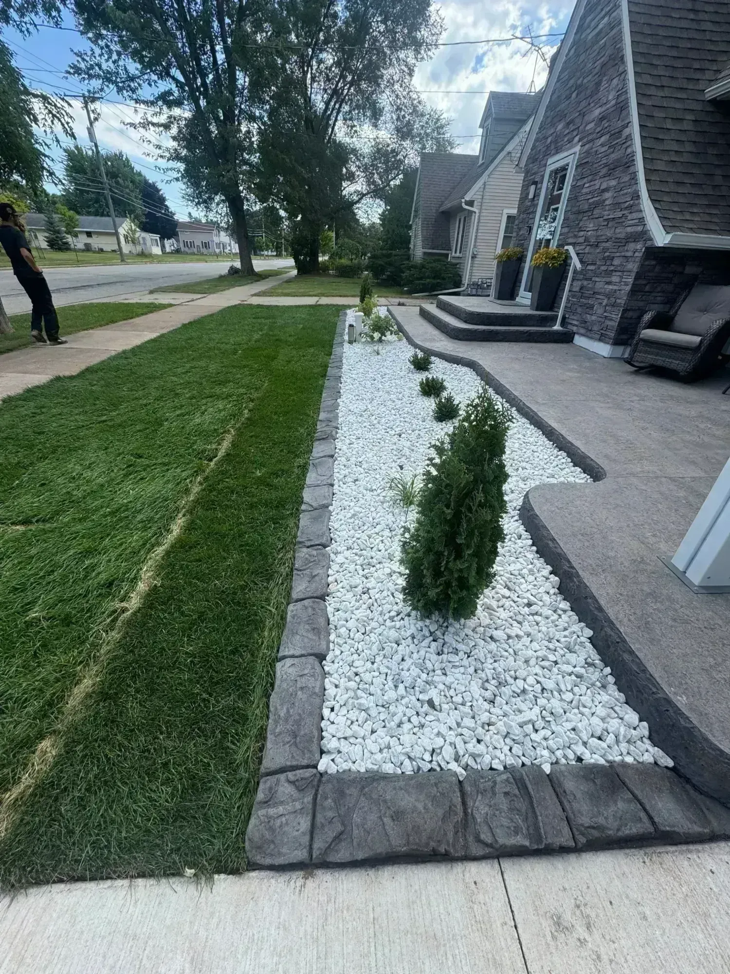 Decorative stamped curbing with perennial garden