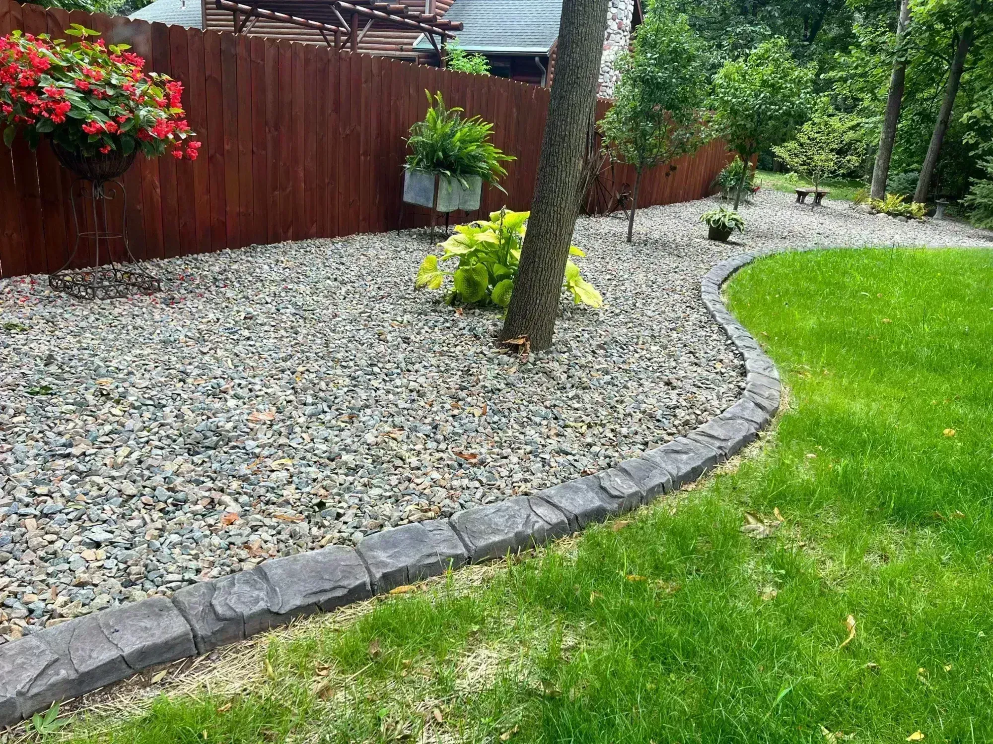 Concrete curbing along a garden bed in a Northwoods Wisconsin yard Concrete curbing along a garden bed in a Northwoods Wisconsin yard